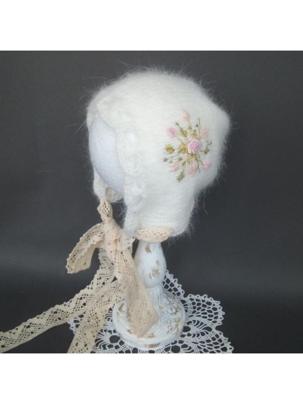 Knitted angora bonnet with embroidery